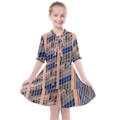 Low Angle Photography Of Beige And Blue Building Kids  All Frills Chiffon Dress by Pakrebo